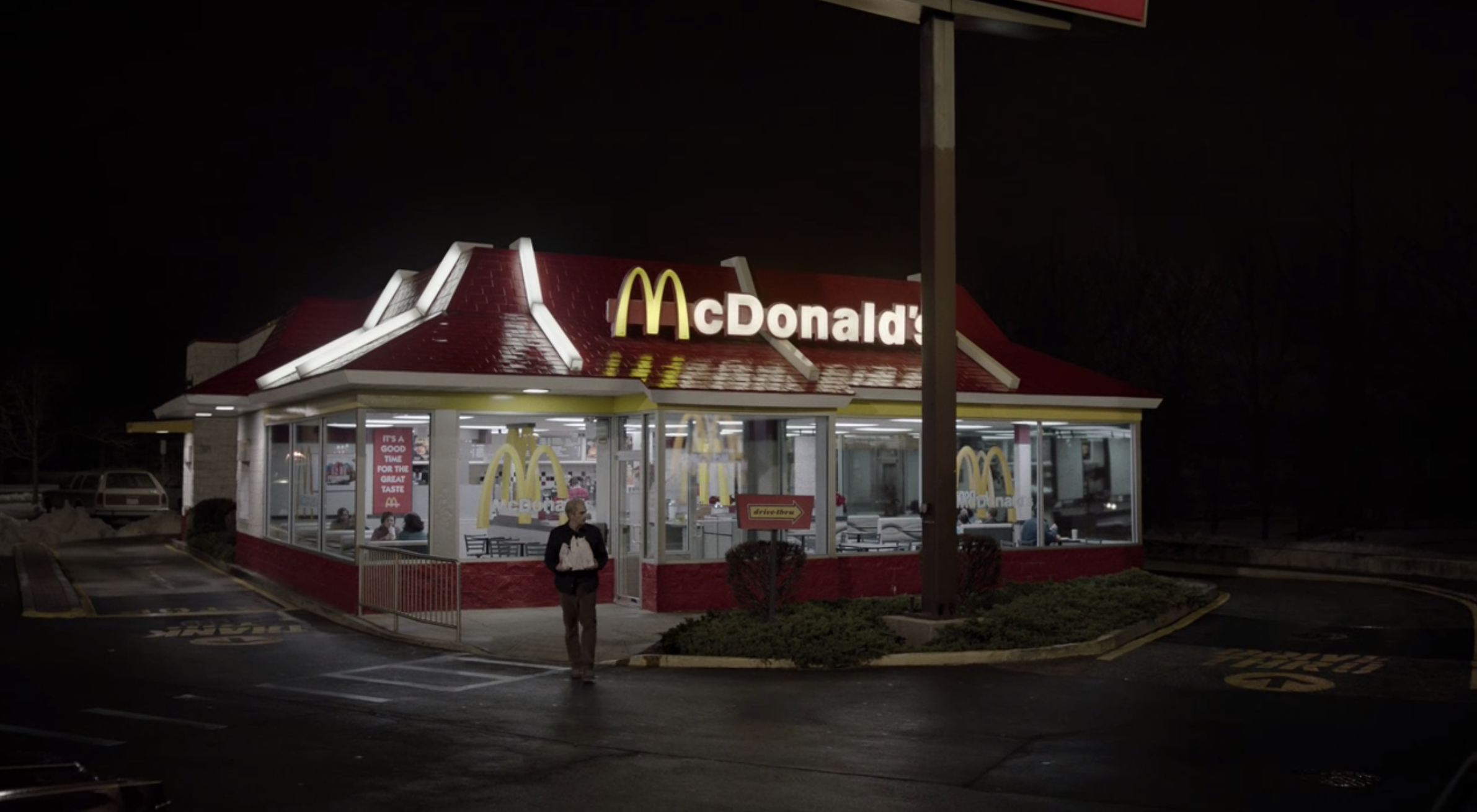 Philip (Matthew Rhys) walking out of McDonald's before continuing to flee the country with his family.